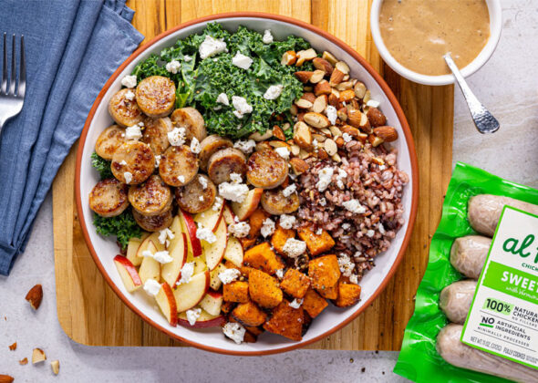 A bowl of fresh apples, almonds, kale, sweet potato, and Al Fresco Sweet Apple Chicken Sausage